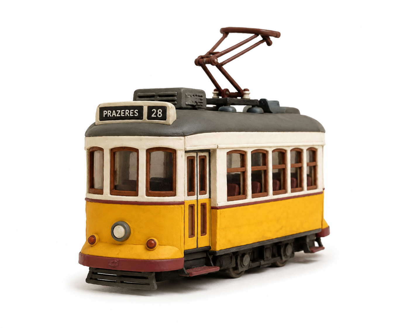 Clay miniature of a yellow Lisbon Remodelado tram, route 28 to Prazeres, on calçada